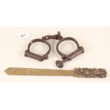 A Japanese brass paper knife plus a pair of early handcuffs