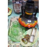 A German orange and black vase, Art Deco green glass part trinket set,
