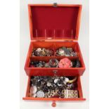 A wooden jewellery box with costume jewellery contents including brooches, bangles,