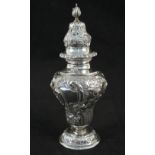 A silver floral embossed sugar caster,