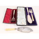 Cased silver fish servers with ivory handles,