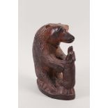 A wooden carving of a bear with cub