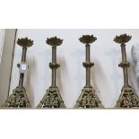 A set of four Victorian brass candlesticks by M.C.