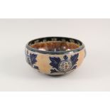 A Royal Doulton stoneware bowl with thistle decoration,