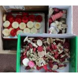 A large quantity of vintage plain and stained ivory chess and draughts pieces