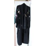 A Chinese black silk floral embroidered robe