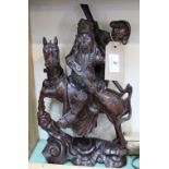 A Chinese carved hardwood figure of a mounted warrior and attendant,