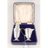 A cased Mappin & Webb silver sugar sifter and cream jug,