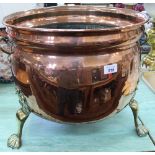 A large copper and brass log bin
