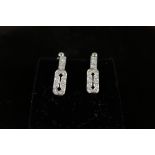 A pair of white gold Art Deco style diamond earrings with screw back fittings