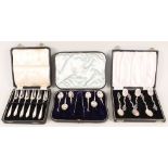 Cased silver cutlery sets including six cake forks, coffee spoons,