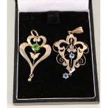 Two Art Nouveau 9ct gold pendants,