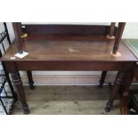 A Victorian mahogany side table with upstand