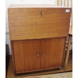 A vintage teak small three door cupboard with two doors and adjustable bookshelves