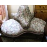 A 19th Century mahogany florally upholstered conversation sofa