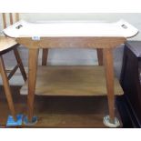 A vintage teak tea table with detachable tray, two stools,