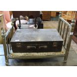 A 19th Century brass dog's bed on wheels and a wooden Army storage box