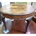 A burr-walnut veneer circular table on cabriole legs