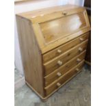 A modern pine four drawer bureau