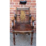 A vintage oak barber's chair