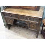 A 1920's oak four drawer desk