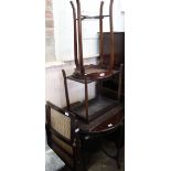 A folding rattan chair and three mahogany occasional tables