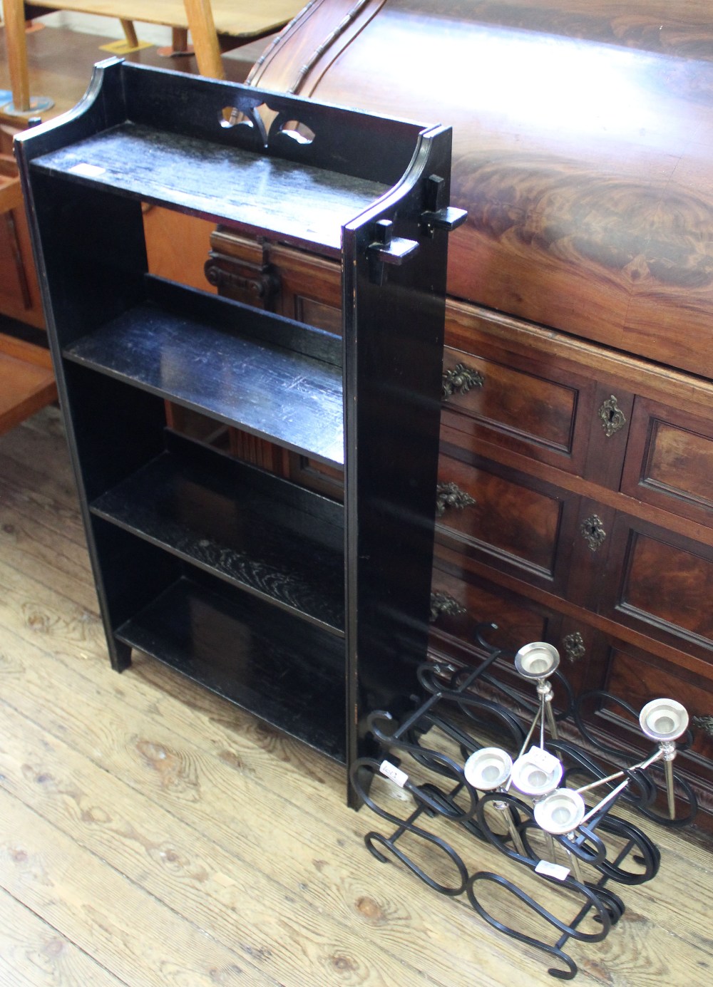 A dark oak Arts and Crafts style free standing bookcase,