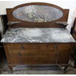 An Edwardian oak slate top wash stand with four drawers