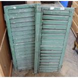 A pair of vintage French green painted shutters