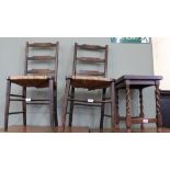 A pair of dark stained pine rush seat ladder back chairs and a barley twist table