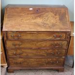 A Georgian mahogany four drawer bureau