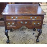 A 19th Century mahogany four drawer lowboy on ball and claw feet