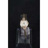 A 9ct gold lady's Tudor Royal wristwatch on 9ct gold strap