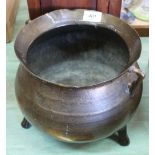 A 17th Century bronze cauldron with bellied body, flared rim,