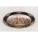 A 19th Century French oval porcelain plate depicting a battle scene,