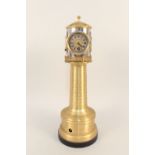 A brass cased lighthouse clock with rear facing barometer,