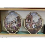 A pair of 19th Century porcelain Cries of London wall plaques,