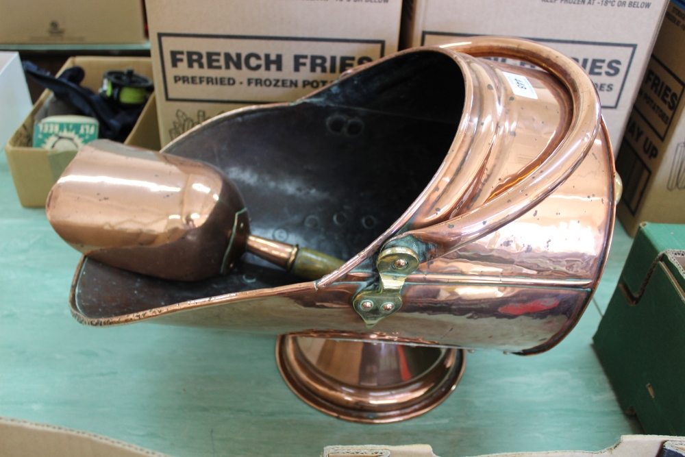 A 19th Century copper coal helmet and scoop