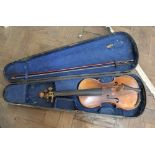 An old cased violin with bow