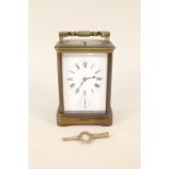 A brass cased alarm carriage clock