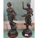 A pair of French spelter figures of maidens,