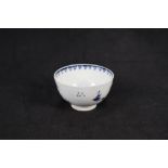 A Lowestoft bridge and pagoda blue and white tea bowl (cracked)