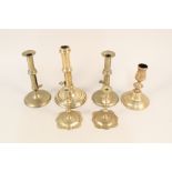 Four 18th Century brass candlesticks to include a pair with side ejectors plus a pair of brass
