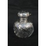 A silver mounted glass scent bottle, hallmarked William Comyns,