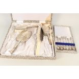 A German silver five piece dressing table set together with a set of six continental silver