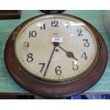 A circular mahogany Smiths dial clock