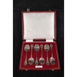 A boxed set of six silver teaspoons with floral engraved teaspoons