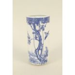 A Japanese blue and white bird and tree decorated brush pot