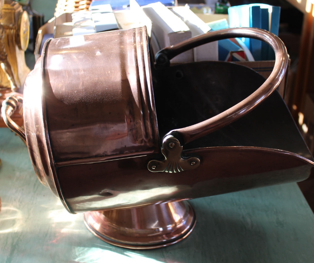 A heavy 19th Century copper coal scuttle with swing and fixed handles