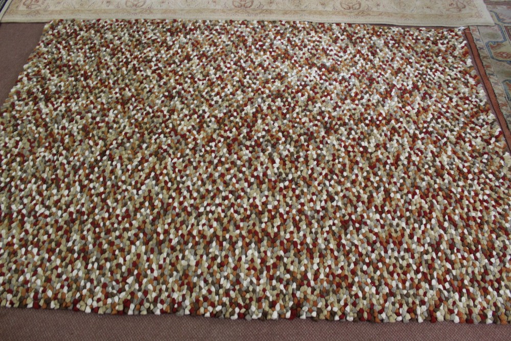 A tufted wool carpet